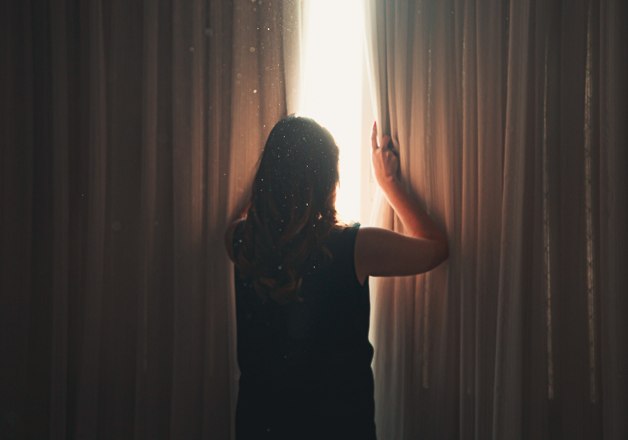 woman looking out of a window